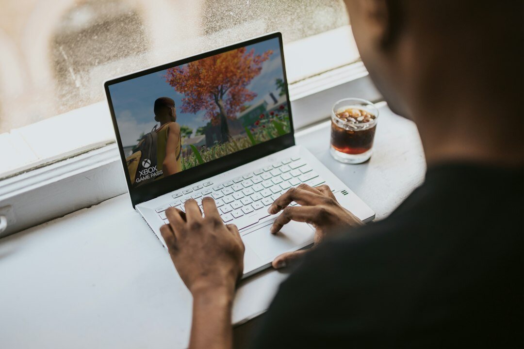 person playing coding game on laptop