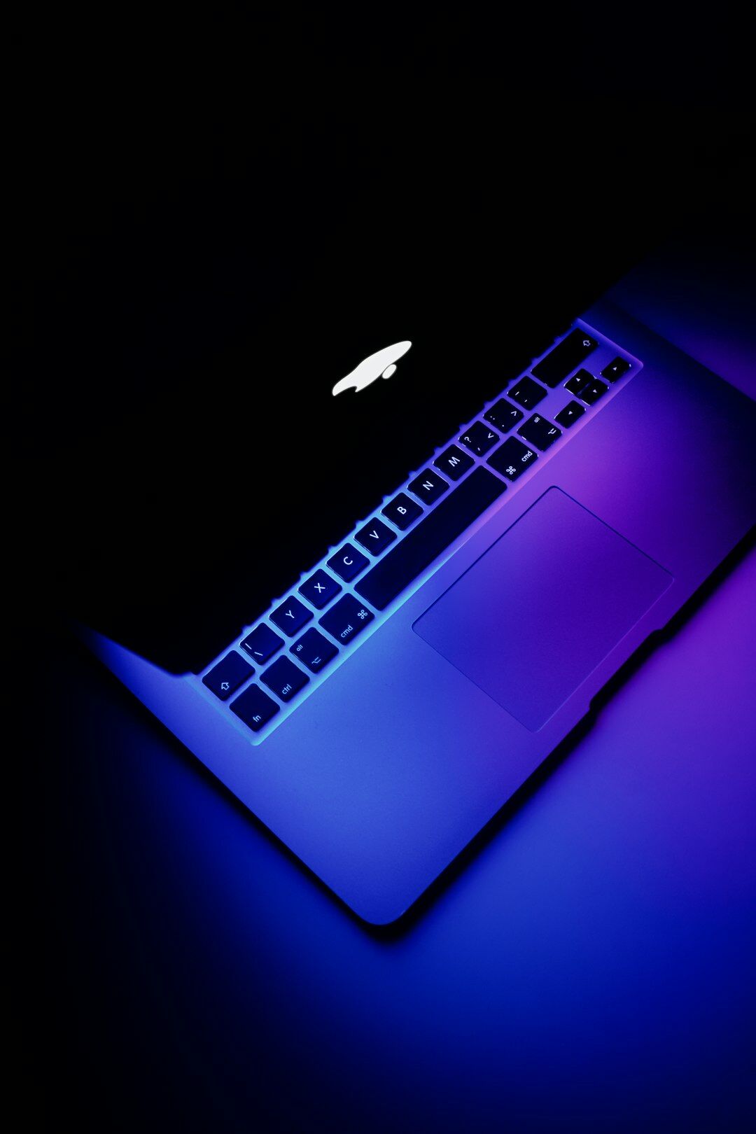Developer typing HTML and CSS code on a laptop