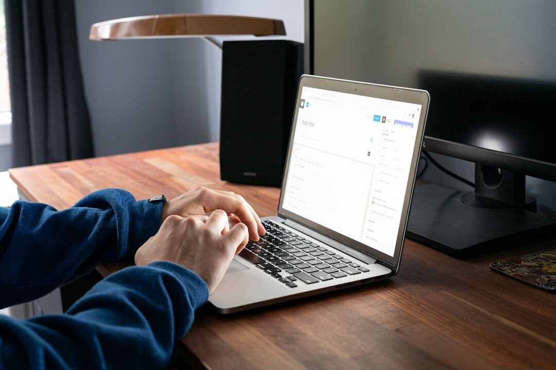 coding on laptop at desk